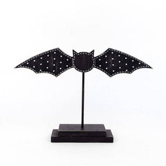 Halloween wooden bat on stand in black rustic style - seasonal holiday decoration