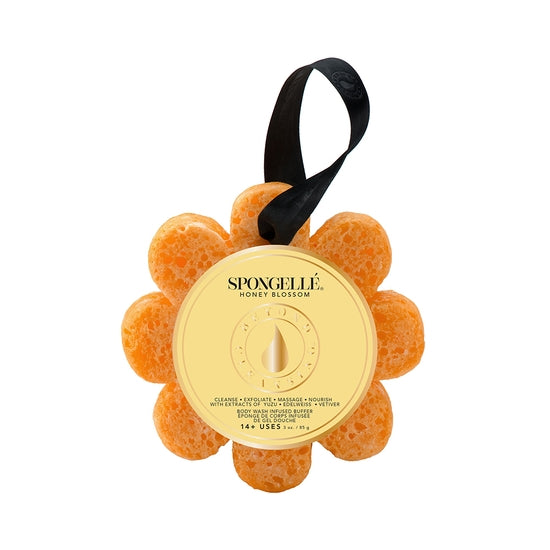 A close up of the orange Honey Blossom Spongelle sponge.