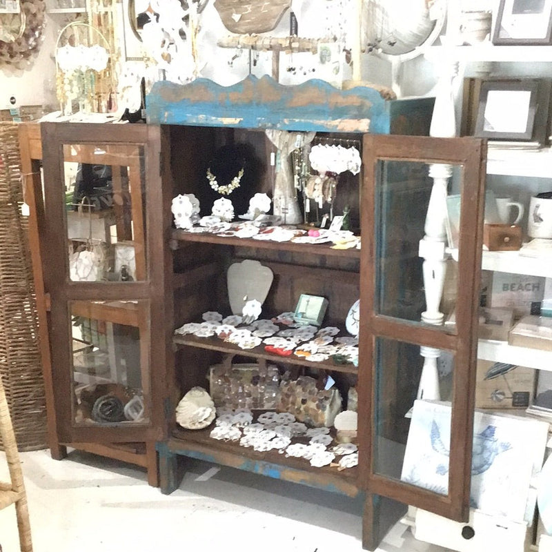 Rustic painted cabinet with patina in blue and natural wood tones