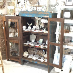 Rustic painted cabinet with patina in blue and natural wood tones