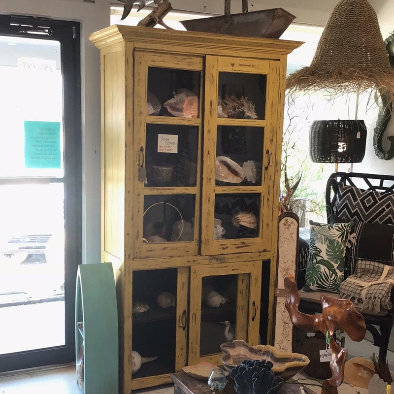 Tall teak yellow wooden cabinet with sliding glass doors – rustic distressed design