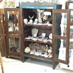 Distressed blue wood cabinet with glass panels – vintage farmhouse design